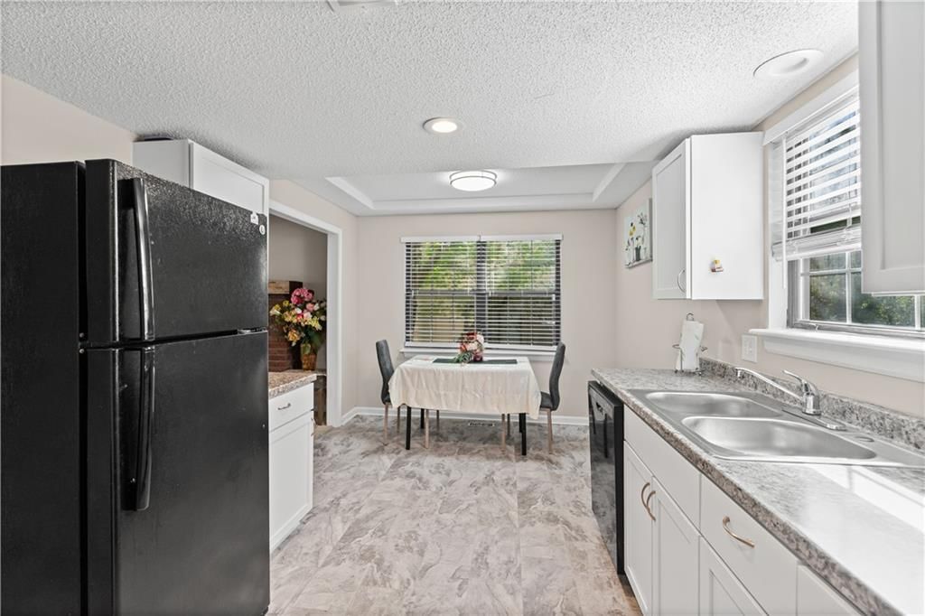 Photo 6: white kitchen cabinets, 10814 Haskins Street, Lenexa, KS 66210