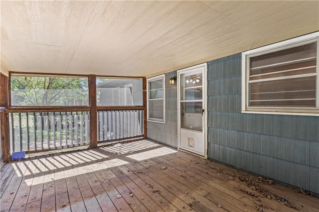 Screened porch and covered patio at 413 Maple Street, Liberty, MO 64068