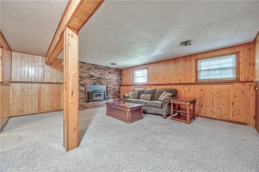 Finished basement, fireplace and shiplap / paneling at 8006 E 89th Street, Kansas City, MO 64138
