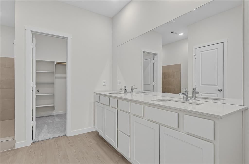 Double vanity and white vanity at 4108 NE Apple Grove Drive, Lee's Summit, MO 64064