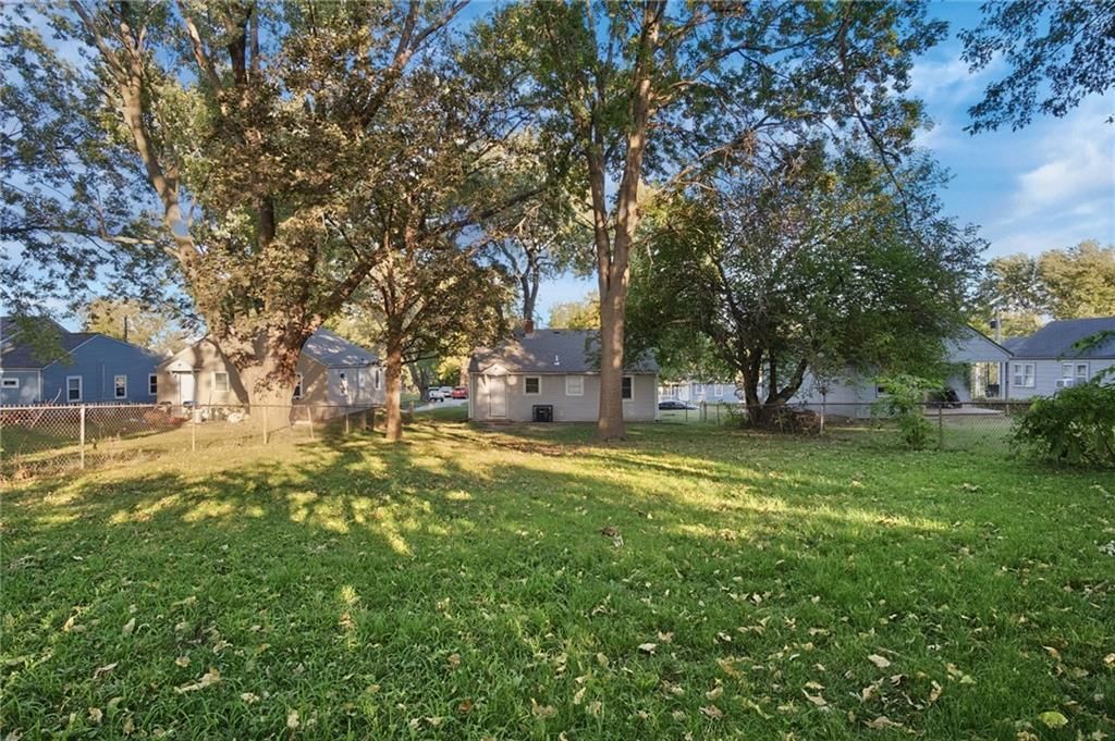 Big backyard, fenced yard and mature trees at 2316 Blue Ridge Terrace, Independence, MO 64052