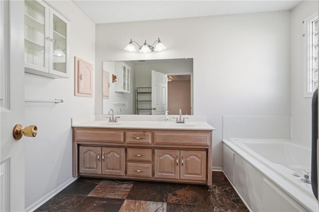 Double vanity and wood vanity at 502 S Saturn Drive, Raymore, MO 64083