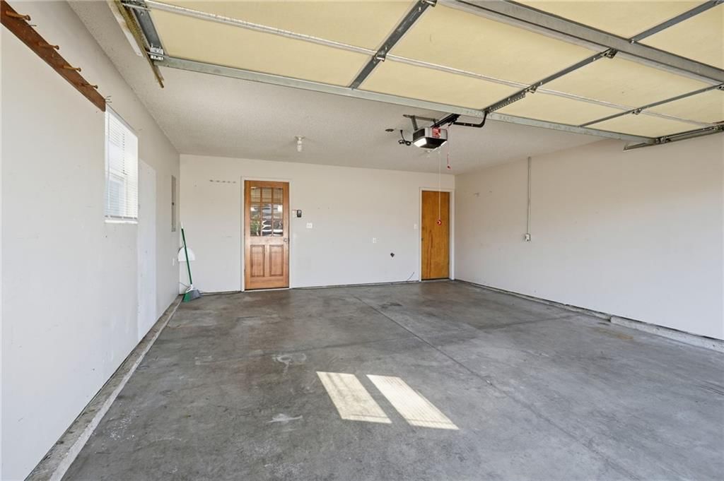 Attached garage at 502 S Saturn Drive, Raymore, MO 64083