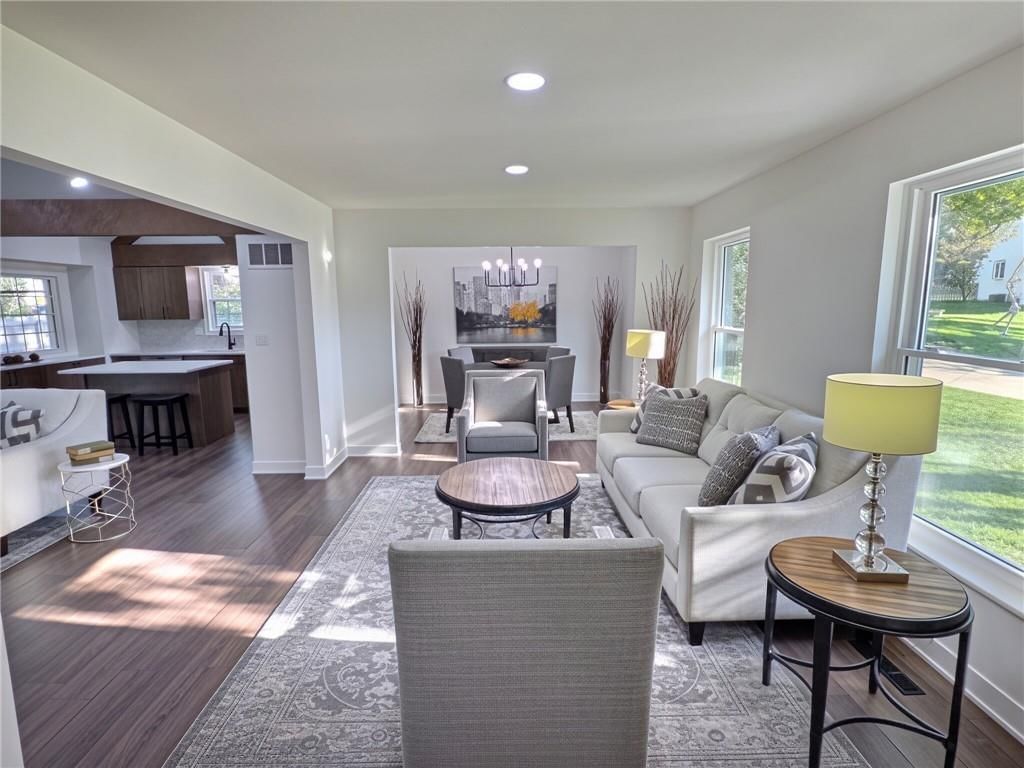 Engineered wood floors, white trim and white walls at 8809 Widmer Road, Lenexa, KS 66215