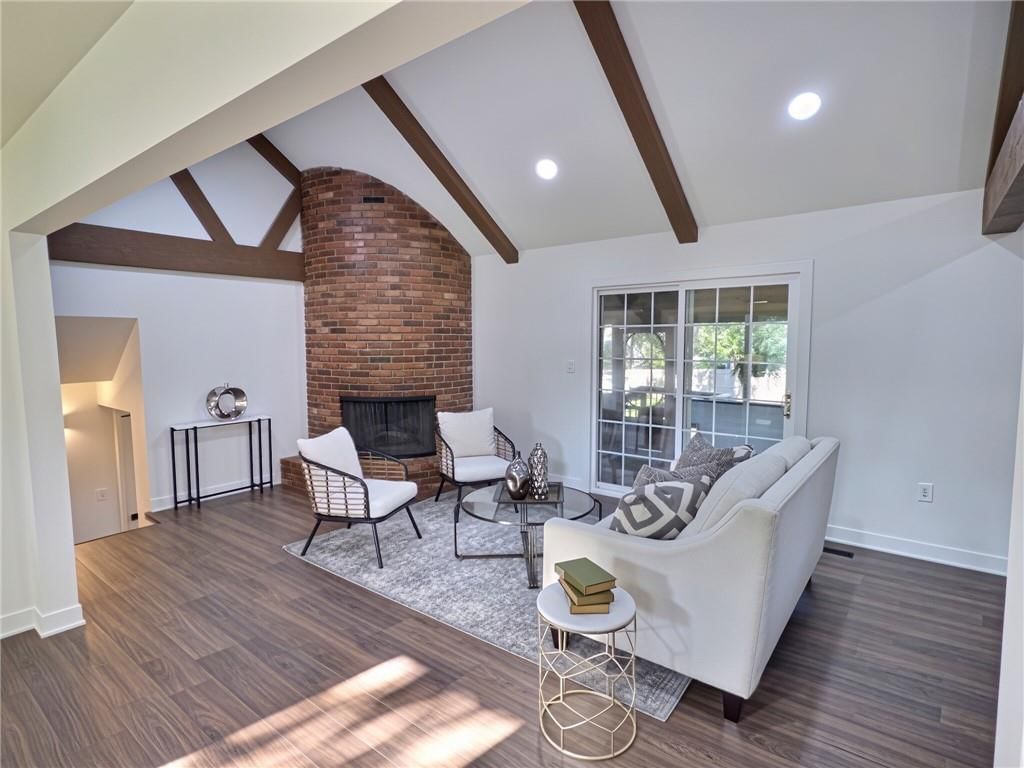 Tall ceilings, fireplace and exposed brick wall at 8809 Widmer Road, Lenexa, KS 66215