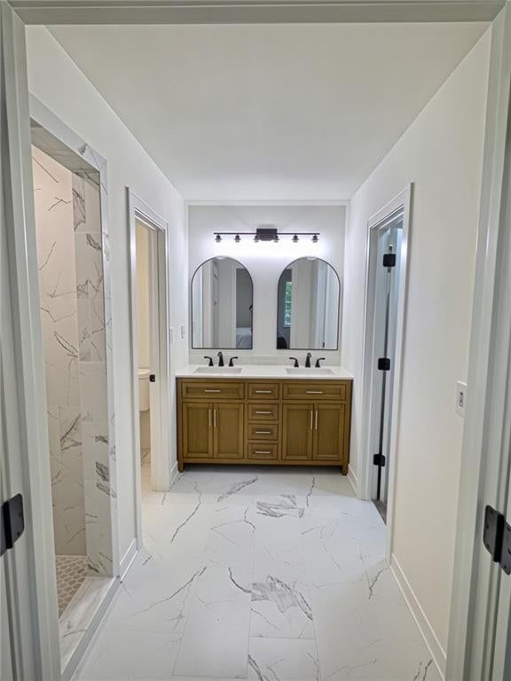 Double vanity, wood vanity and renovated bathrooms at 8809 Widmer Road, Lenexa, KS 66215