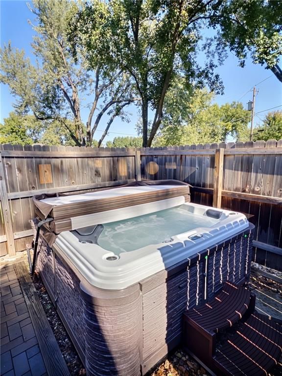 Fenced yard and paver patio at 8809 Widmer Road, Lenexa, KS 66215