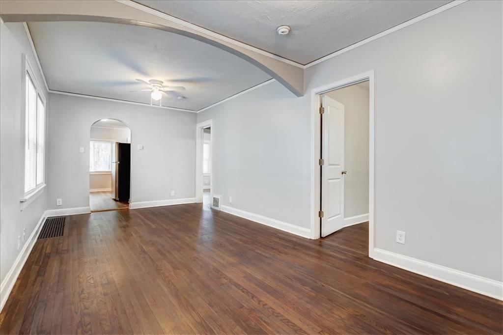 Hardwood floors, black hardware and white trim at 6015 Park Avenue, Kansas City, MO 64130