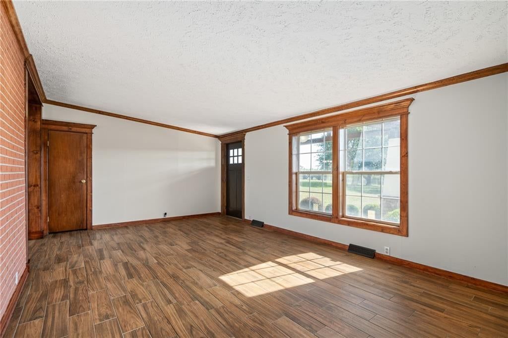 Open floor plan, kitchen island and granite counters at 25160 W 223rd Street, Spring Hill, KS 66083