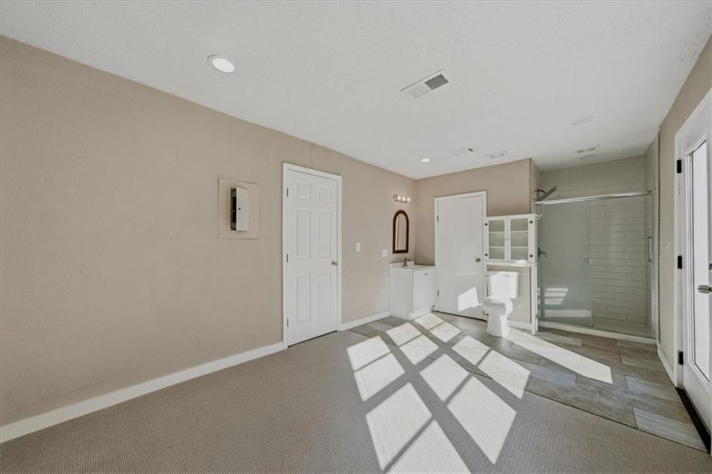 Walk-in shower, tiled shower and frameless glass shower at 4311 Bales Avenue, Kansas City, MO 64130