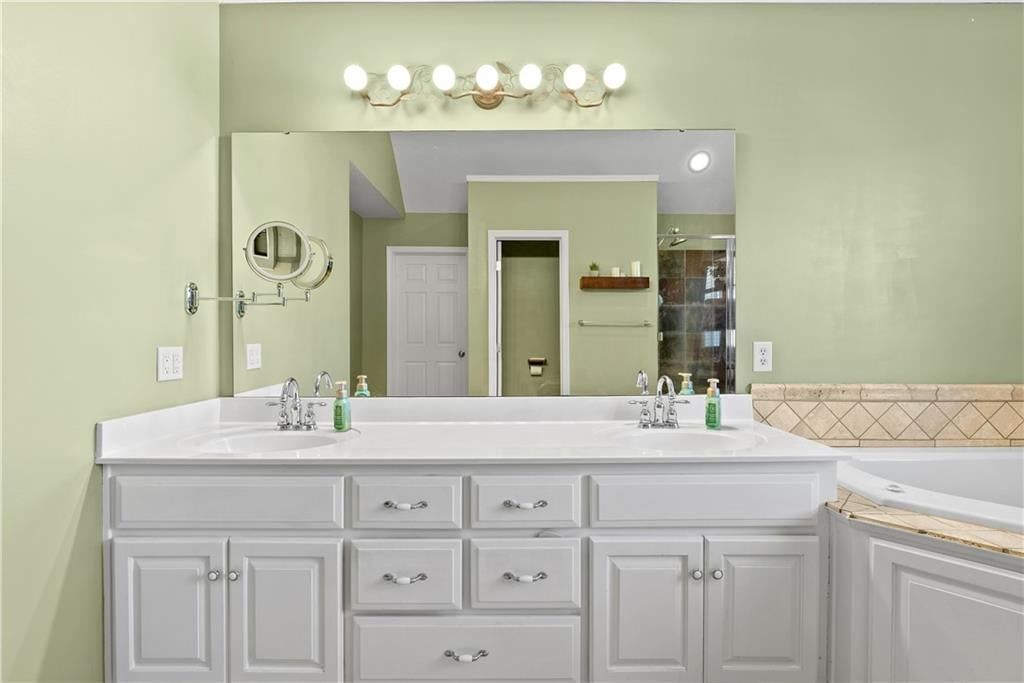 Walk-in shower and tiled shower at 15815 E 76th Street, Kansas City, MO 64139