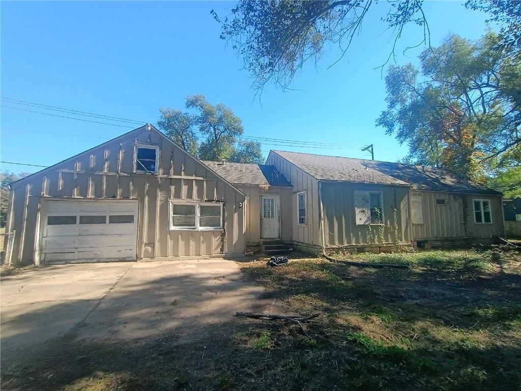 Attached garage and concrete driveway at 8408 Blue Ridge Boulevard, Raytown, MO 64138