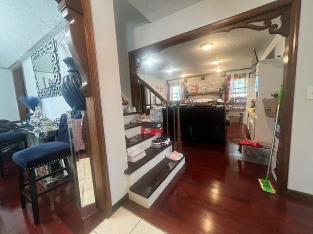 Staircase and wood stair railing at 7700 E 127 Place, Grandview, MO 64030