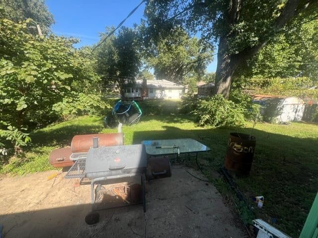 Big backyard, fenced yard and concrete patio at 7700 E 127 Place, Grandview, MO 64030