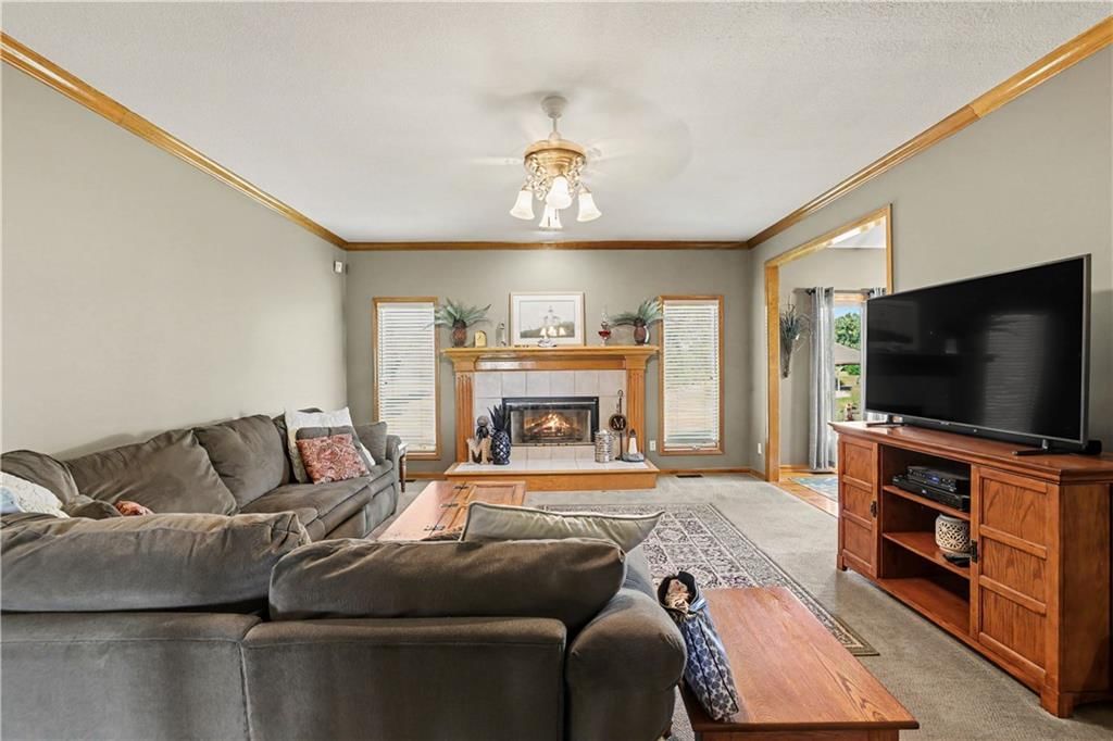 Fireplace and greige walls at 14891 142nd Street, Bonner Springs, KS 66012