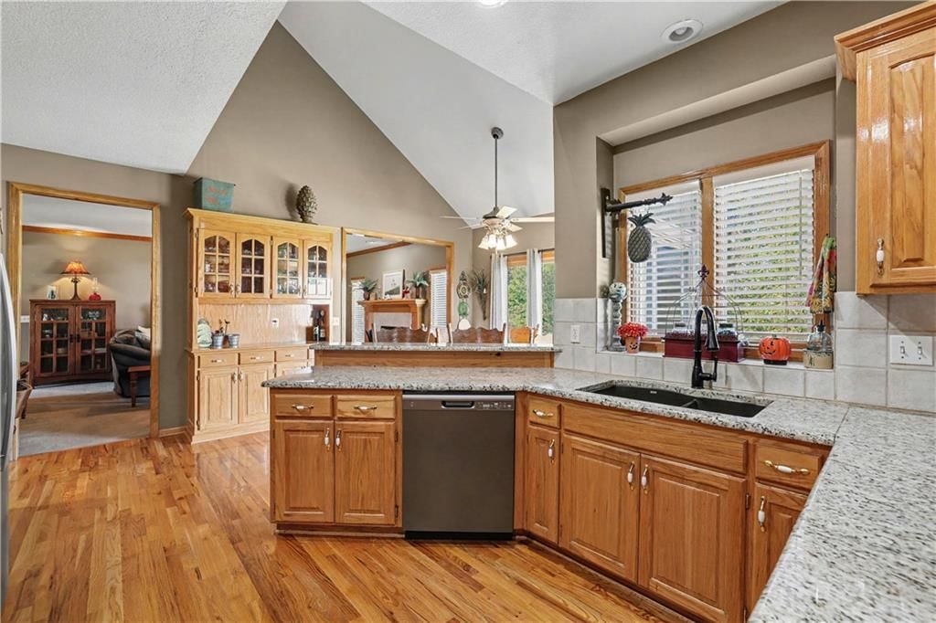 Tall ceilings, open floor plan and kitchen island at 14891 142nd Street, Bonner Springs, KS 66012