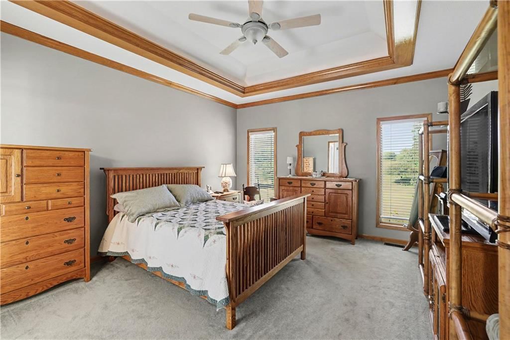 Main-floor primary bedroom and carpet at 14891 142nd Street, Bonner Springs, KS 66012