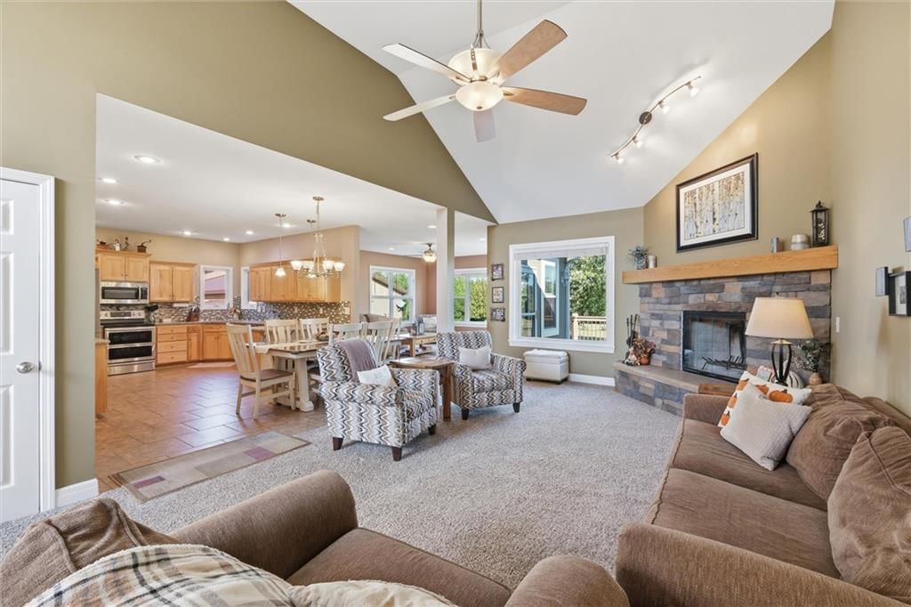 Tall ceilings, fireplace and open floor plan at 27423 New Lancaster Road, Louisburg, KS 66053
