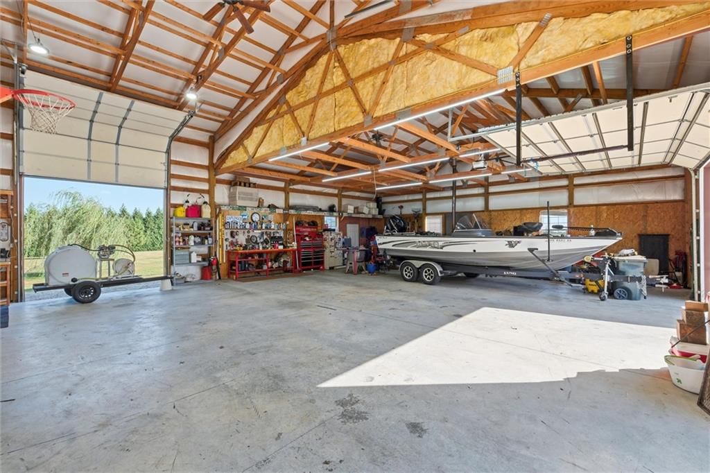 Workshop and basketball hoop at 27423 New Lancaster Road, Louisburg, KS 66053