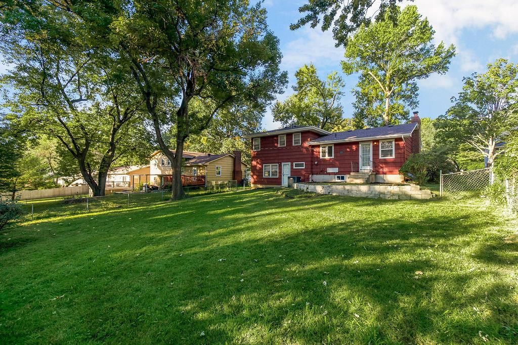 Big backyard, fenced yard and mature trees at 7719 Howe Drive, Prairie Village, KS 66062