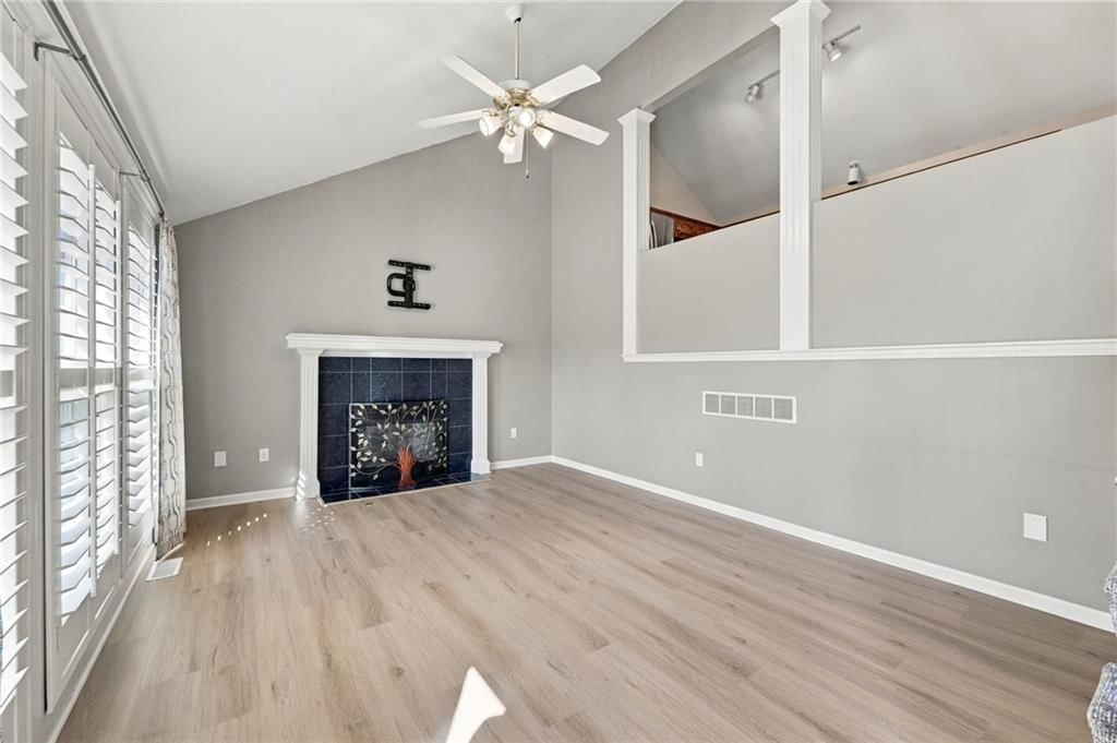 Tall ceilings, fireplace and hardwood floors at 9504 NW 87th Terrace, Kansas City, MO 64153