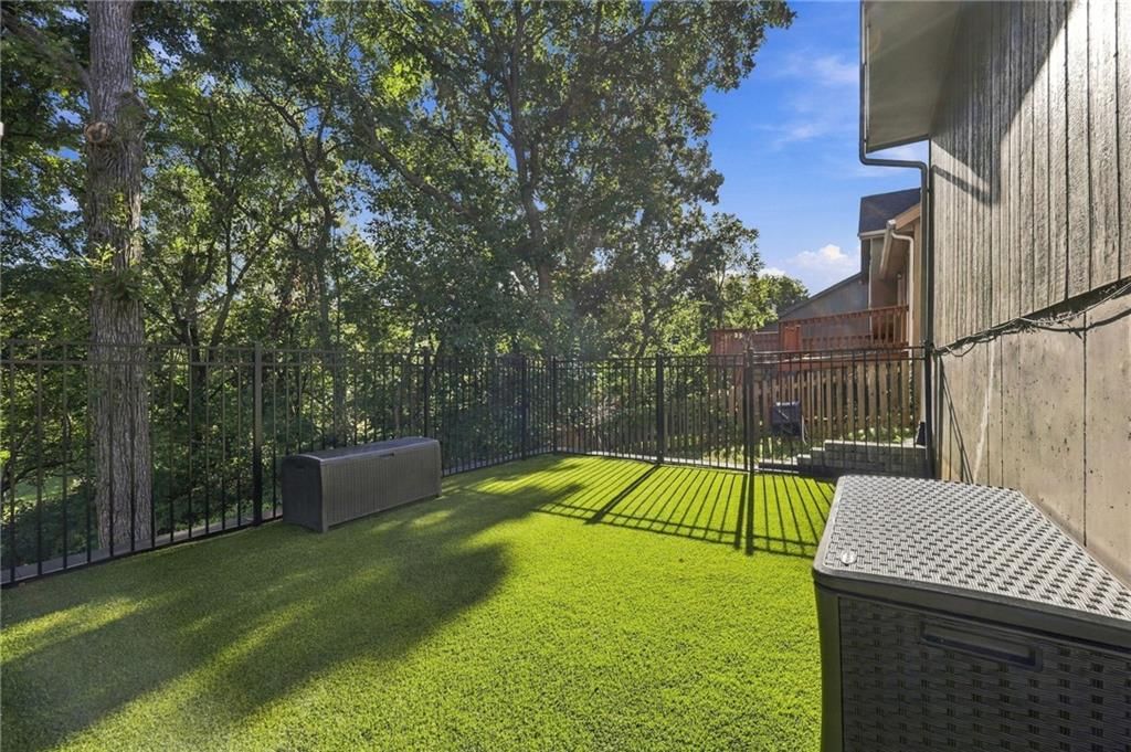 Fenced yard and iron fence at 9504 NW 87th Terrace, Kansas City, MO 64153