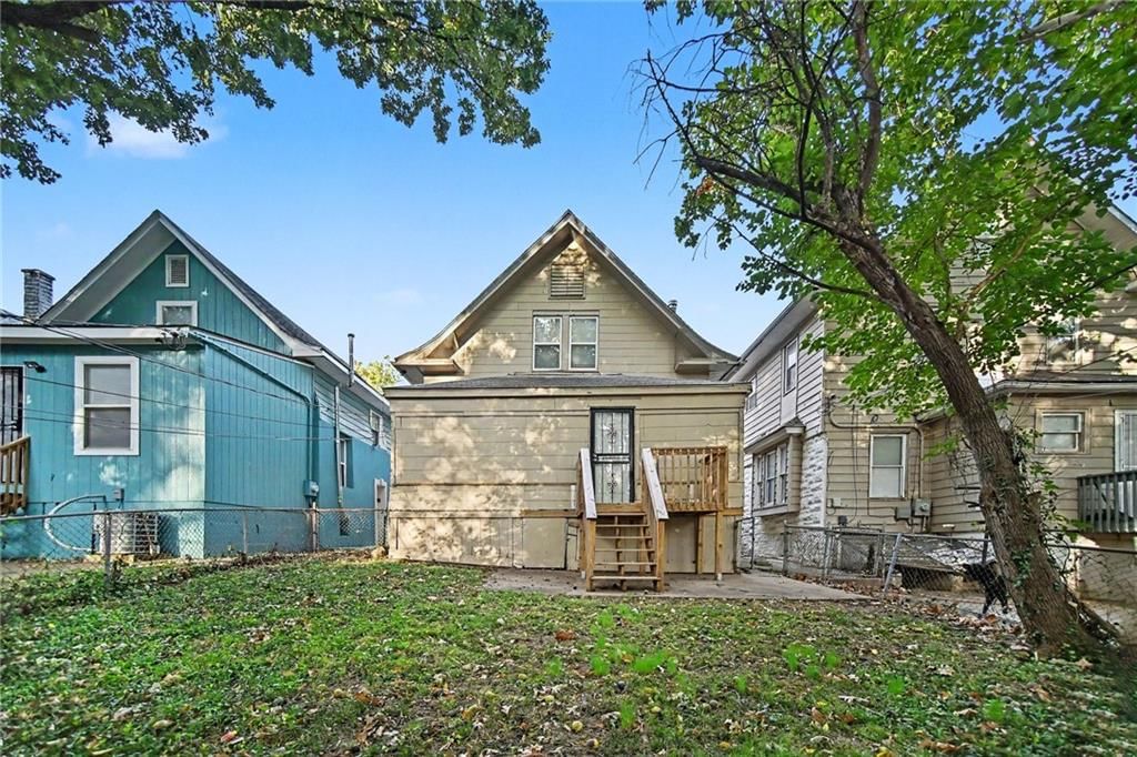 Deck, fenced yard and mature trees at 1603 Elmwood Street, Kansas City, MO 64127