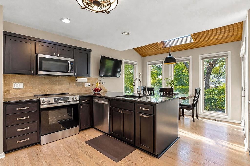 Kitchen island and kitchen backsplash at 18401 W 114th Terrace, Olathe, KS 66061