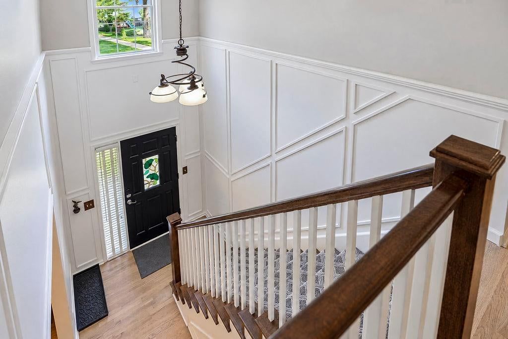 Shiplap / paneling, staircase and black hardware at 18401 W 114th Terrace, Olathe, KS 66061
