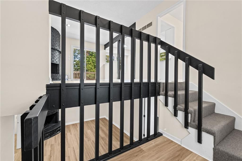 Staircase, iron stair railing and white trim at 14710 NW 67th Street, Parkville, MO 64152