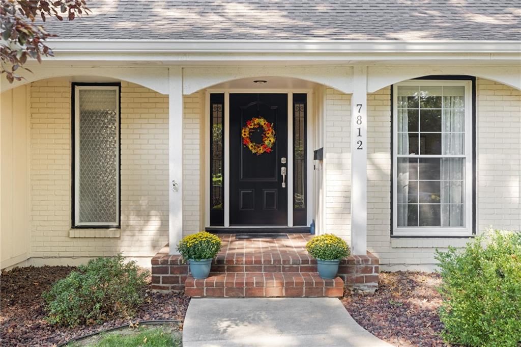 Covered front porch at 7812 W 100th Terrace, Overland Park, KS 66212