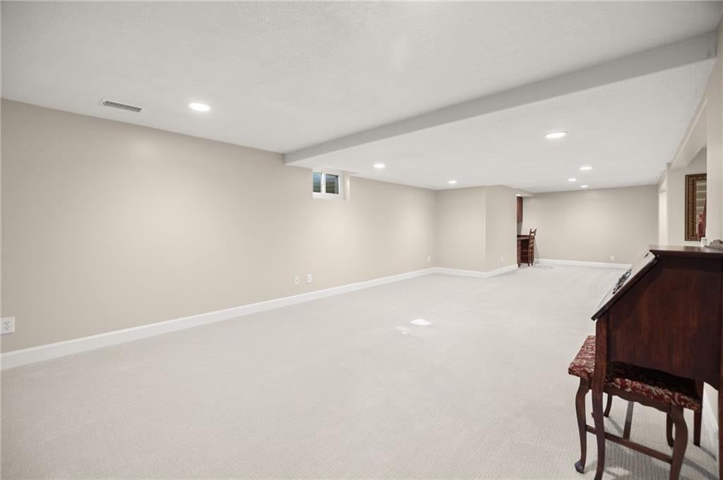 Finished basement, wet bar and staircase at 7812 W 100th Terrace, Overland Park, KS 66212
