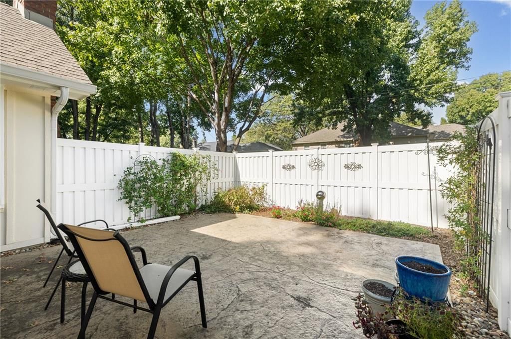 Big backyard, fenced yard and mature trees at 7812 W 100th Terrace, Overland Park, KS 66212