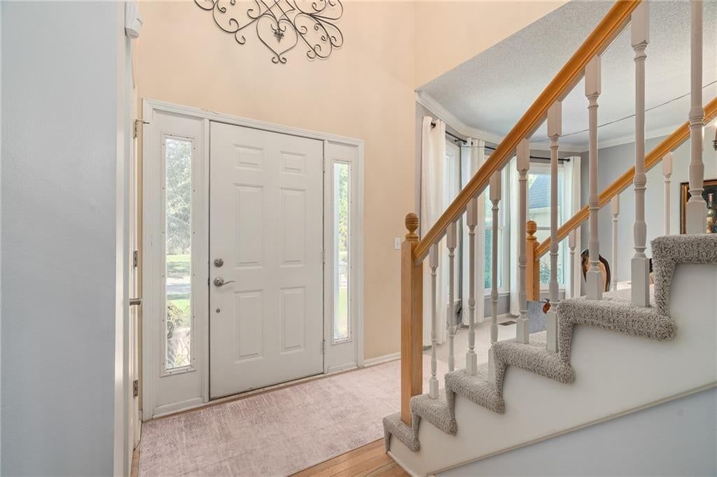 Staircase, wood stair railing and white trim at 11229 W 117th Street, Overland Park, KS 66210