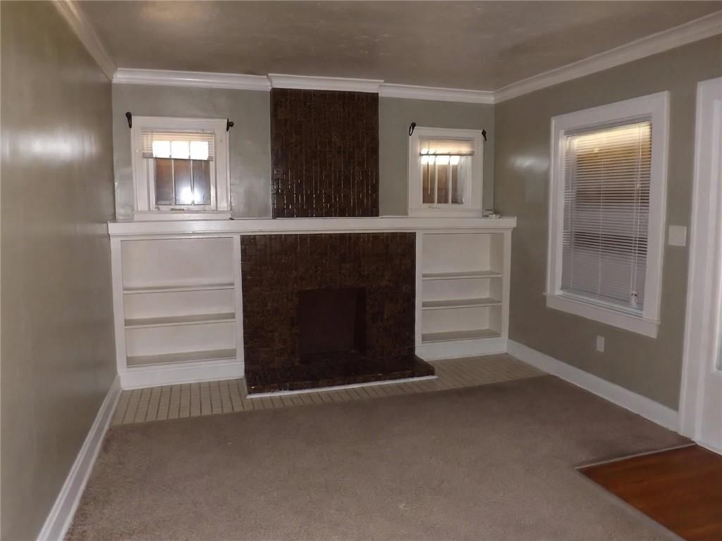 Fireplace, white trim and carpet at 340 Elmwood Avenue, Kansas City, MO 64124