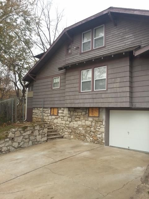 Attached garage and concrete driveway at 340 Elmwood Avenue, Kansas City, MO 64124