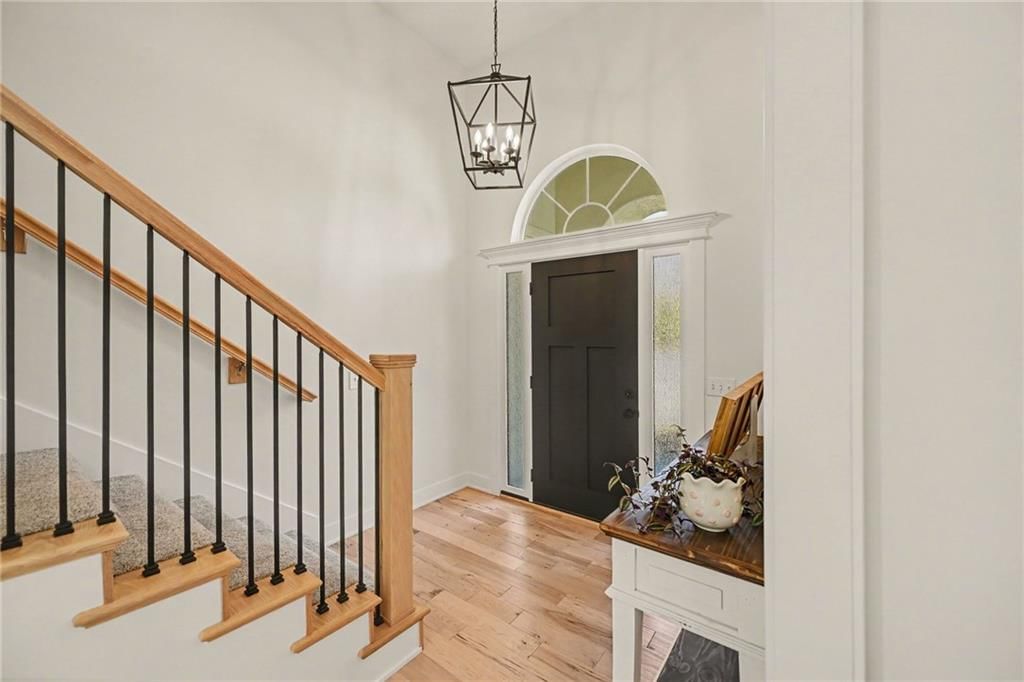 Staircase, iron stair railing and white trim at 20831 W 102nd Street, Lenexa, KS 66220