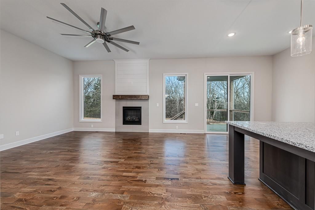 Fireplace, open floor plan and mature trees at 15627 Austin Court, Basehor, KS 66007