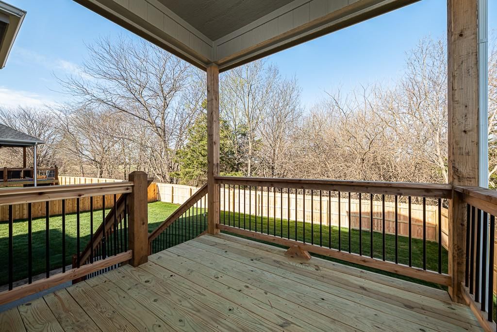 Deck, fenced yard and covered patio at 15627 Austin Court, Basehor, KS 66007