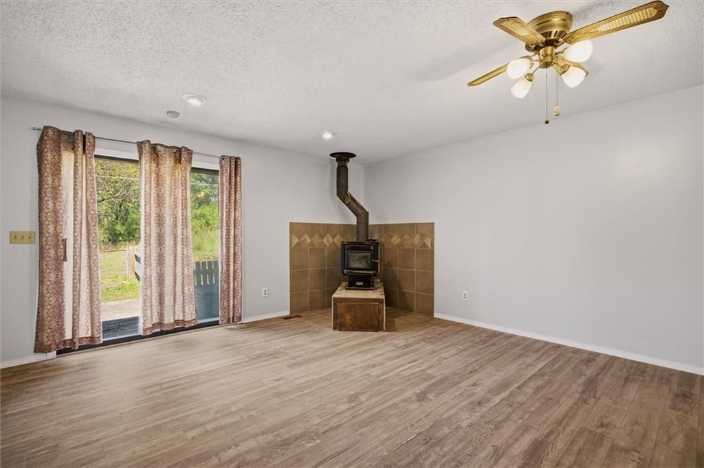Fireplace and open floor plan at 5538 Webster Avenue, Kansas City, KS 66104