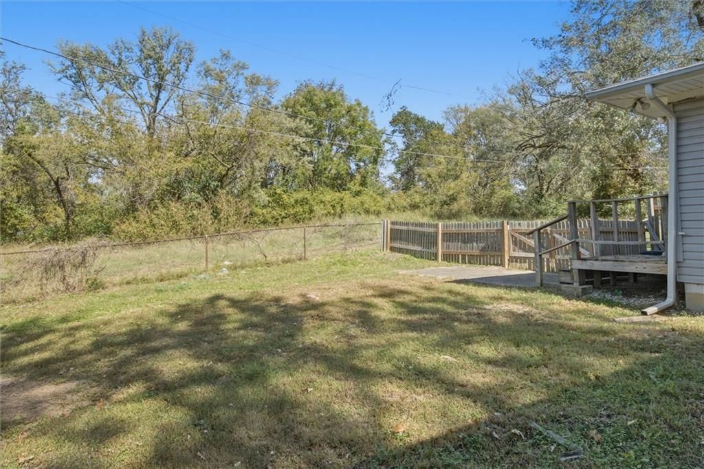 Fenced yard, paver patio and wood fence at 5538 Webster Avenue, Kansas City, KS 66104