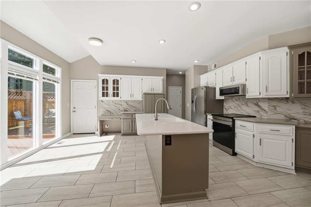 Photo 17: white kitchen cabinets, 9409 W 131st Street, Overland Park, KS 66213
