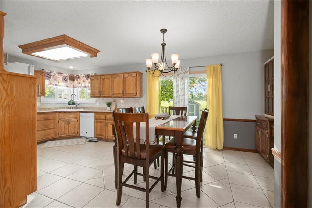 Statement lighting and breakfast nook at 1628 NE AUBURN Drive, Lee's Summit, MO 64086