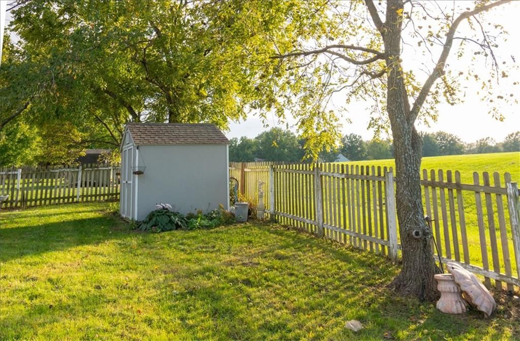 Fenced yard and mature trees at 1628 NE AUBURN Drive, Lee's Summit, MO 64086