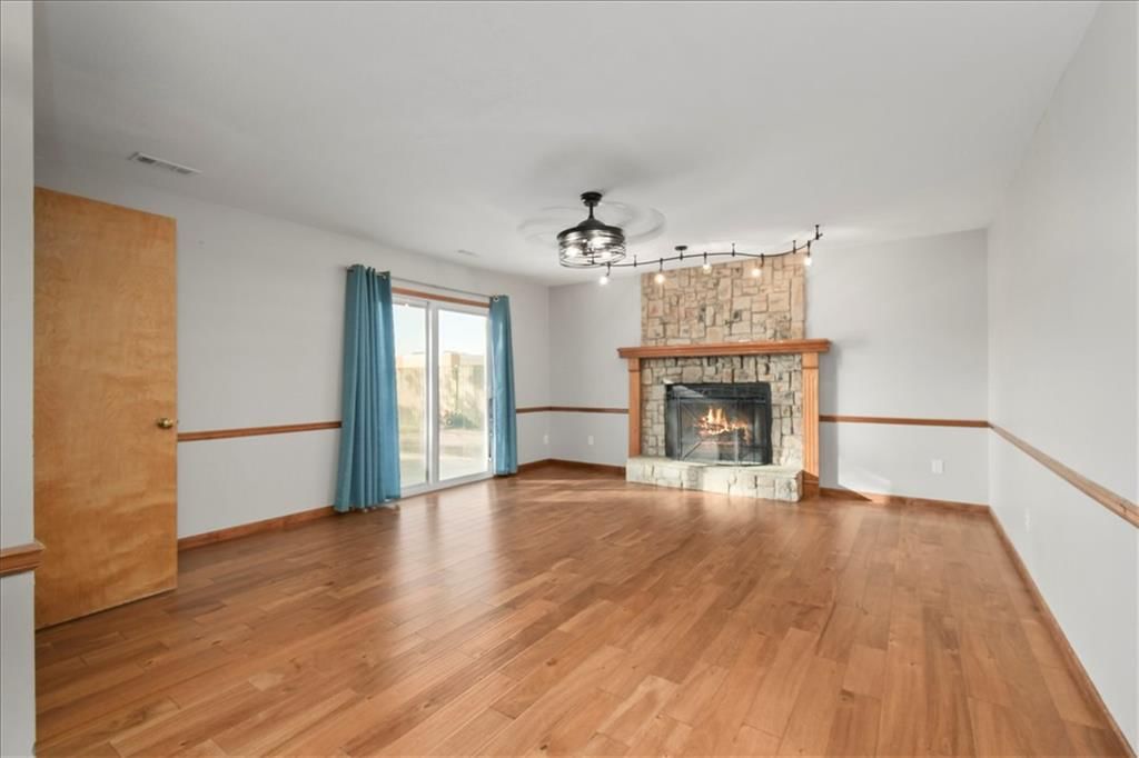 Fireplace and hardwood floors at 1628 NE AUBURN Drive, Lee's Summit, MO 64086