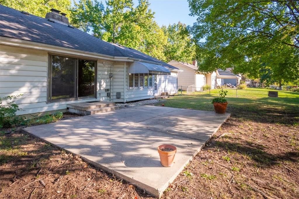 Big backyard, fenced yard and wood fence at 11000 Washington Street, Kansas City, MO 64114