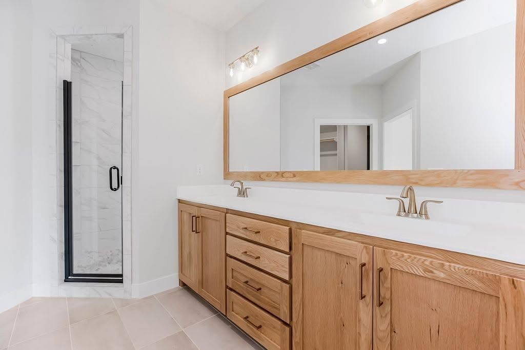 Walk-in shower, tiled shower and frameless glass shower at 2313 Larkspur Lane, Kearney, MO 64060