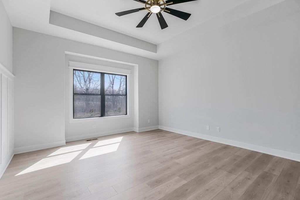 Main-floor primary bedroom, wainscoting or board and batten and shiplap / paneling at 2313 Larkspur Lane, Kearney, MO 64060
