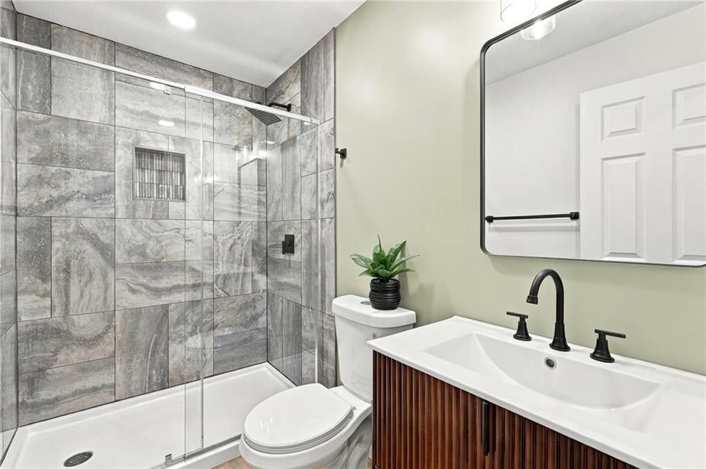Walk-in shower, tiled shower and frameless glass shower at 15401 E 36th Street S, Independence, MO 64055