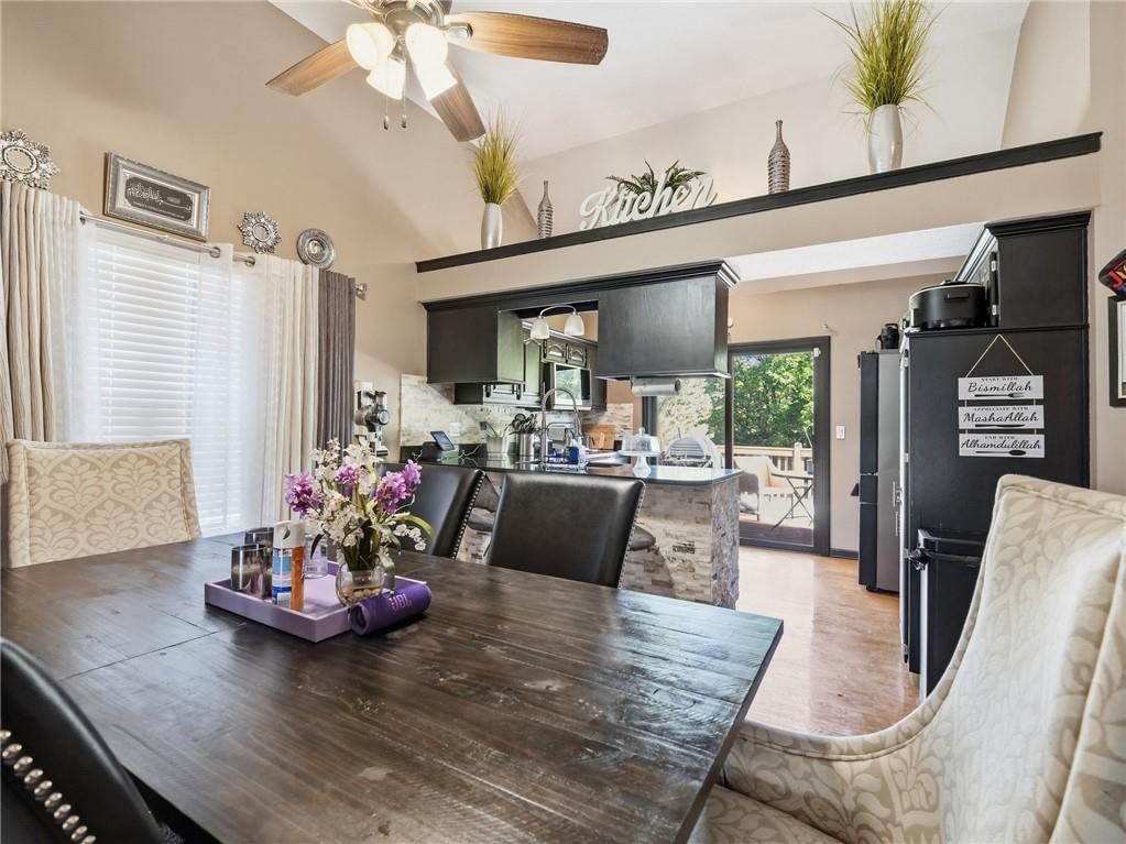 Open floor plan, statement lighting and breakfast nook at 337 NE Dreamweaver Avenue, Lee's Summit, MO 64086